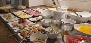 a table with many different types of food on it at Hotel Hillegosser Hof in Bielefeld