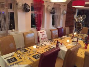 a table set up for a meal in a restaurant at The Royal Hotel in Mundesley