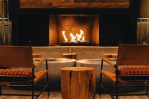 a fireplace that has a fire place in it at Waypoint Hotel in Bend