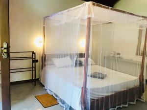 Letto o letti in una camera di Mango Tree House
