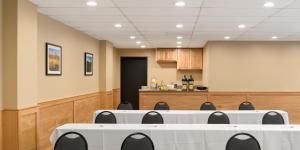 a conference room with a table and chairs and a counter at Waypoint Hotel in Bend +37 photos