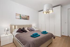 Giường trong phòng chung tại Design Apartment Opatija
