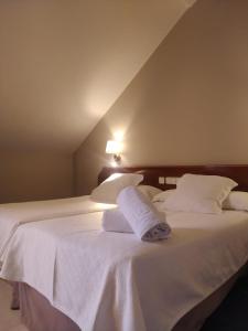 Postel nebo postele na pokoji v ubytování Hotel Olimpo