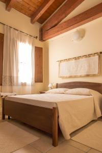 Letto o letti in una camera di Albergo Diffuso Il Mandorlo
