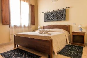 Letto o letti in una camera di Albergo Diffuso Il Mandorlo