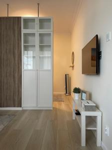 Televízia a/alebo spoločenská miestnosť v ubytovaní Baltica Sea Apartment