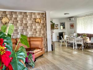 a living room with a couch and a table at Villa Eliza in Denia