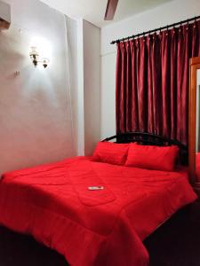 Postel nebo postele na pokoji v ubytování AhmedEja Ferringhi Homestay