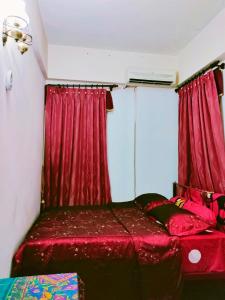 Postel nebo postele na pokoji v ubytování AhmedEja Ferringhi Homestay