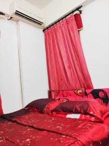 Postel nebo postele na pokoji v ubytování AhmedEja Ferringhi Homestay