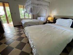Voodi või voodid majutusasutuse Azure Camotes Resort Hotel toas