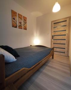 Postel nebo postele na pokoji v ubytování Apartamenty Gdańsk