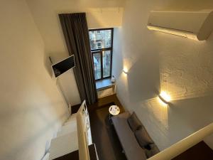 an overhead view of a staircase with a window at Lift Hotel Boutique - Derybasivska in Odesa