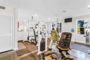 a gym with treadmills and ellipticals in a room at Grand Caribbean #103 in Orange Beach