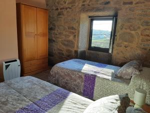 Postel nebo postele na pokoji v ubytování Casita de norma
