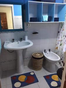a bathroom with a sink and a toilet at Casa J Dias in Nordeste +17 photos