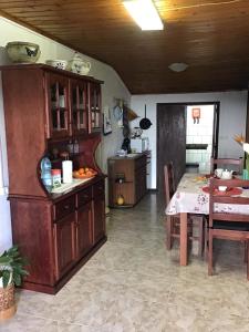 a kitchen with a table and a dining room at Casa J Dias in Nordeste
