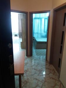 a living room with a view of a room with a bedroom at G21 in Batumi