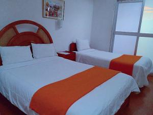 Voodi või voodid majutusasutuse Hostal Tu Hogar toas