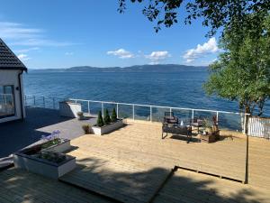 a patio with a view of the water at Seaside Rentals in Trondheim