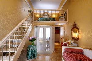 Posteľ alebo postele v izbe v ubytovaní Hotel Canaletto