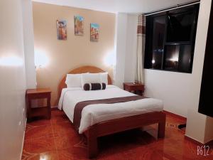 A bed or beds in a room at El Tambo Machupicchu