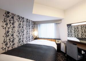 Postel nebo postele na pokoji v ubytování APA Hotel & Resort Niigata Ekimae Odori + 37 fotografií