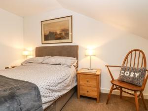 En eller flere senge i et værelse på Ebenezer Cottage
