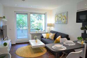 Гостиная зона в Gemütliches und Modernes Apartement in Grünen Top-Lage Münster