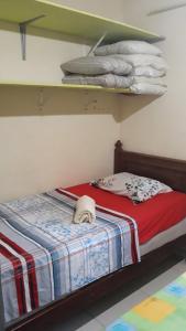 เตียงในห้องที่ Casa de praia em São Pedro da Aldeia