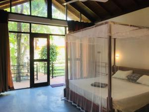 Letto o letti in una camera di Mango Tree House