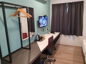 Sjónvarps- og/eða afþreyingartæki á T SQUARE HOTEL (IPOH)
