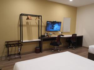 Sjónvarps- og/eða afþreyingartæki á T SQUARE HOTEL (IPOH)