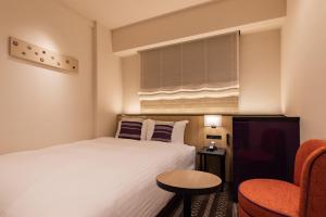 Postel nebo postele na pokoji v ubytování Hotel Vista Fukuoka Nakasu-Kawabata