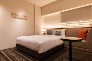 Postel nebo postele na pokoji v ubytování Hotel Vista Fukuoka Nakasu-Kawabata