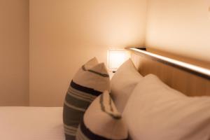 Postel nebo postele na pokoji v ubytování Hotel Vista Fukuoka Nakasu-Kawabata