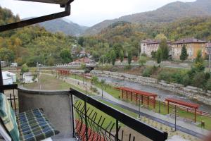 a view of a river from the balcony of a building at Apartament Hanna - Straja in Uricani