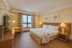 Cama ou camas em um quarto em Blue Tree Towers Caxias do Sul