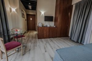 Postel nebo postele na pokoji v ubytování Hotel Petra