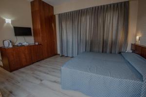 Postel nebo postele na pokoji v ubytování Hotel Petra