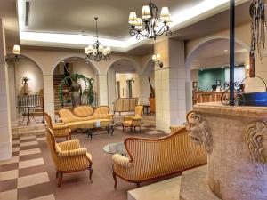 a lobby with chairs and a waiting room at Kitabiwako Hotel Grazie in Nagahama