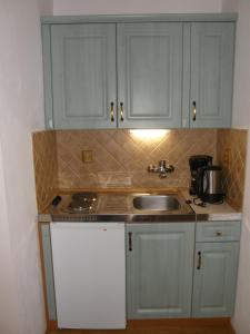 Kuchyňa alebo kuchynka v ubytovaní Apartmány Šmika