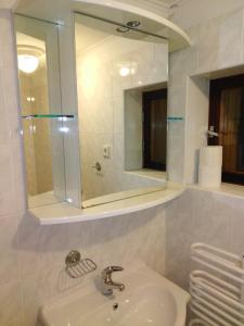 a bathroom with a sink and a mirror at Apartmány Šmika in Rokytnice nad Jizerou