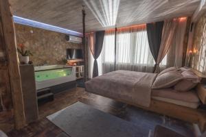 Postel nebo postele na pokoji v ubytování Onore dell amore 2 apartman sa djakuzijem