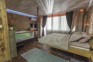 Postel nebo postele na pokoji v ubytování Onore dell amore 2 apartman sa djakuzijem