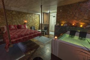 Postel nebo postele na pokoji v ubytování Onore dell amore 2 apartman sa djakuzijem