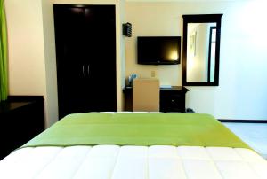 Postel nebo postele na pokoji v ubytování Hotel Ocean View