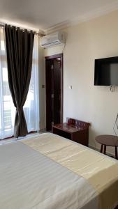 Postel nebo postele na pokoji v ubytování Roseau Hotel And Spa