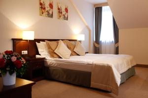 מיטה או מיטות בחדר ב-Hotel Nowodwory