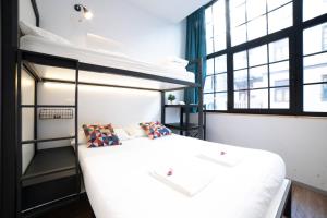 Postel nebo postele na pokoji v ubytování Koba Hostel